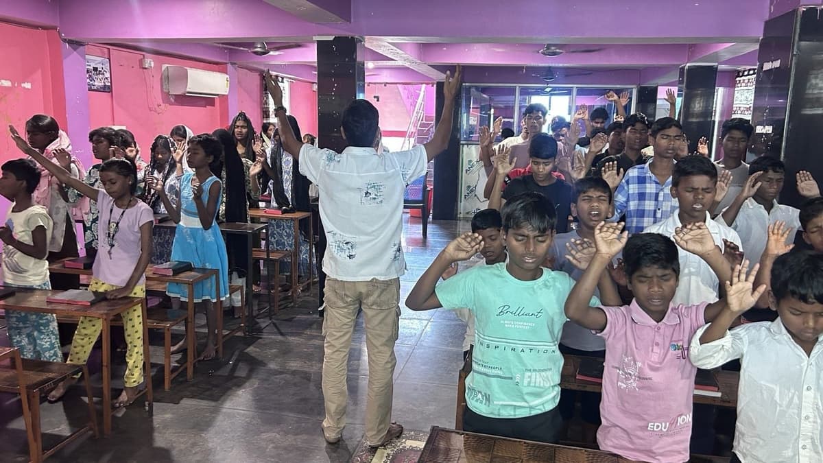 Children in worship at the home