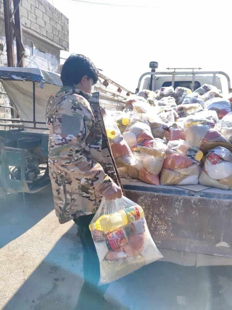 Unloading food aid on the ground