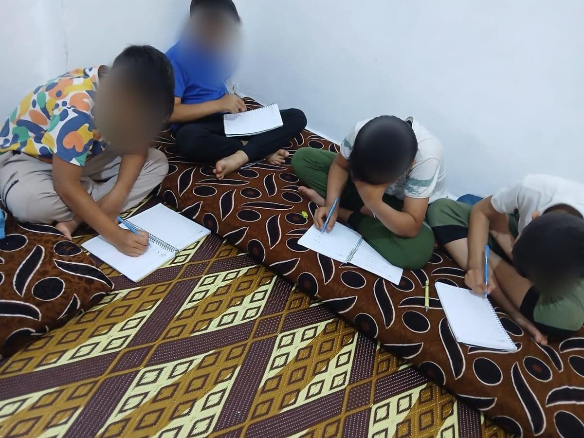 Young believers studying Scripture with notebooks
